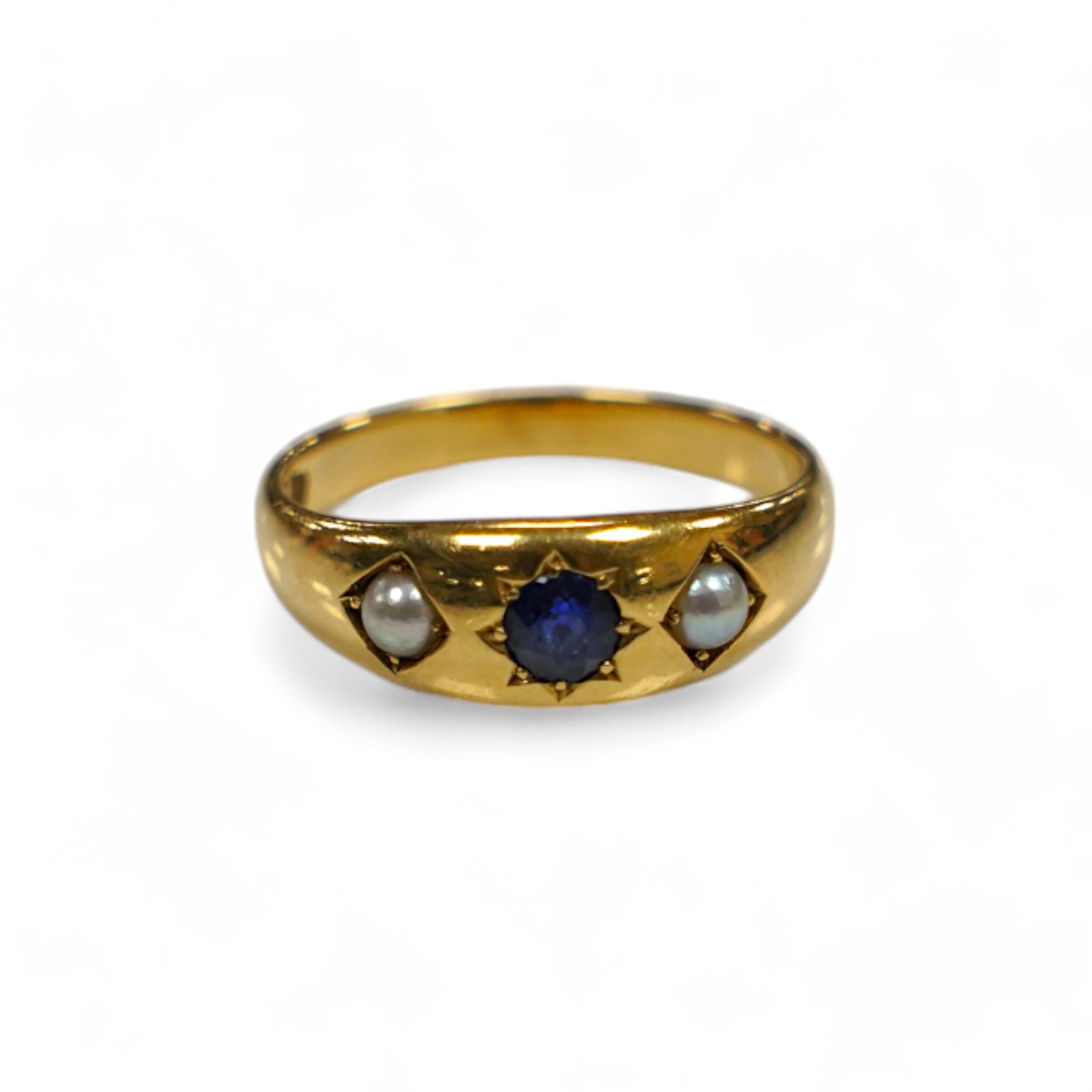 An early to mid 20th century 18ct and gypsy set single stone sapphire and two stone split pearl set ring, size O, gross weight 4.7grams. Condition - poor to fair